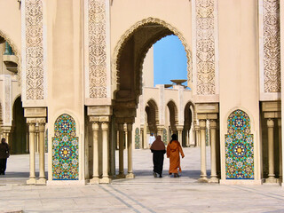 women with chadors at the entrance to the mosque in Casablanca, Morocco