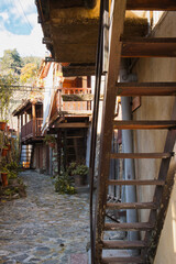 Obraz premium Narrow street and old traditional stone house of authentic mountain village Kakopetria in Troodos mountains, Cyprus