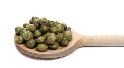 Capers in wooden spoon, edible flower buds isolated on white background