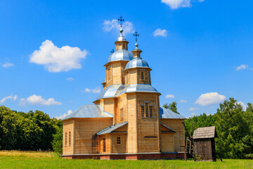 Fototapeta na wymiar Ancient reconstructed wooden church of St. Nicolas in Pyrohiv (Pirogovo) village near Kiev, Ukraine