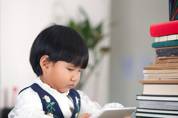 Chinese girl staying at home and taking online class