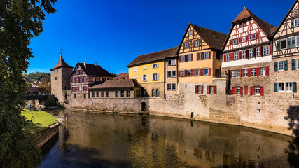 Fototapeta na wymiar Idyllic panorama of the old town of Schwäbisch Hall with the city wall and half-timbered houses at the Kocher river