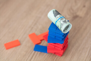 Stacked high blocks on a roll of Korean won banknotes