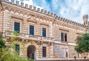Exterior view of the façade of Castello Acquaviva, house of the city council, made of the local Leccese sandstone ("pietra leccese") in Nardò, province of Lecce, Puglia region, Italy.