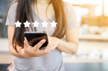 Customer service experience and business satisfaction survey. Close-up image of woman hand using...