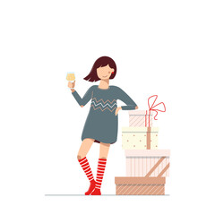 A girl with wineglass is near boxes of gifts on a white background. A young woman in a knee socks and the dress drinking and celebrating a holiday.