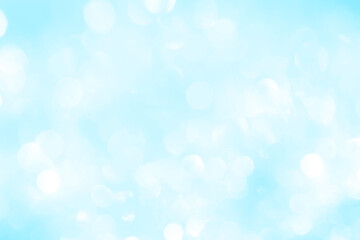 Bokeh light on blue background, sky with circle glitter light blue. Snow abstract soft glowing with vivid bright light and bokeh blur effect. 