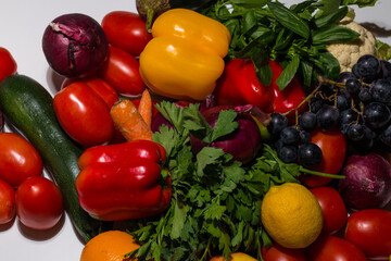 Background of vegetables different fresh farm vegetables. Food or Healthy diet concept. Composition with assorted raw organic vegetables. detox diet: lemon, tomato, pepper, cauliflower, apple, grape