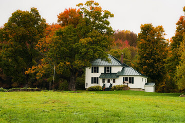 Rustic farm scene in rural vermont during autumn with fall colors changing and a bountiful harvest...