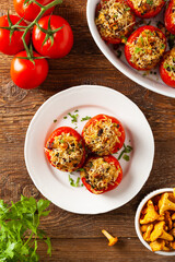 Baked stuffed tomatoes. Stuffed with chanterelles. Top view of the dish.