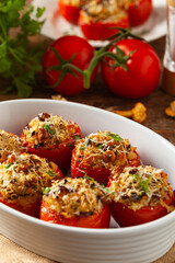 Baked stuffed tomatoes. Stuffed with chanterelles. Top view of the dish.