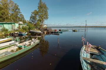 Authentic fisherman village with boats and floating houses in North West Russia.