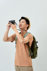 Full length portrait of happy tourist photographer man on white background. Travel blogger, tourist man.