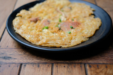 Pan-fried crispy mussel pancake. oyster fried in egg batter