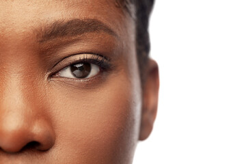 beauty, vision and people concept - close up of face of beautiful young african american woman over...