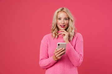 Image of happy beautiful woman using mobile phone and smiling