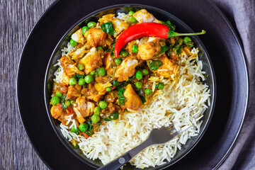 fish curry with green peas in a bowl