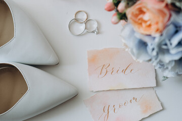 Accessories for the bride: rings, shoes, wedding bouquet and perfume. Morning bride. Wedding details.