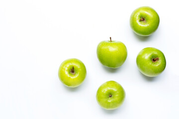 Green apples on white background. Copy space