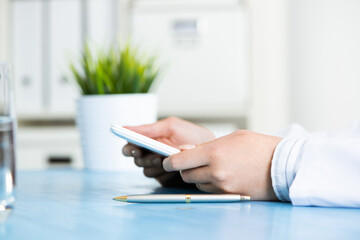 Close up of doctor hands with tablet computer