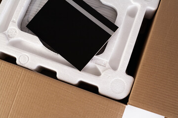 Open cardboard with styrofoam material. Isolated on white background. Transportation of fragile...