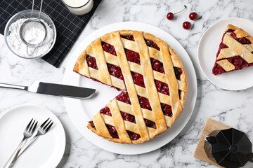 Delicious fresh cherry pie served on white marble table, flat lay