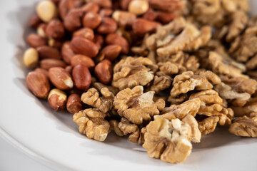healthy pistachios and walnuts on white background