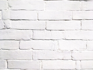 Brick wall painted with white paint