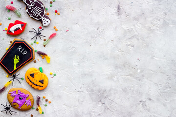 Set of Halloween cookies with candies flat lay, overhead view