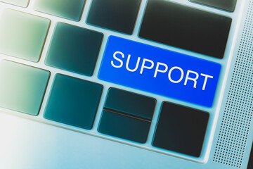 Online IT Support concept. Word imprinted on the keyboard key with blue color highlight.