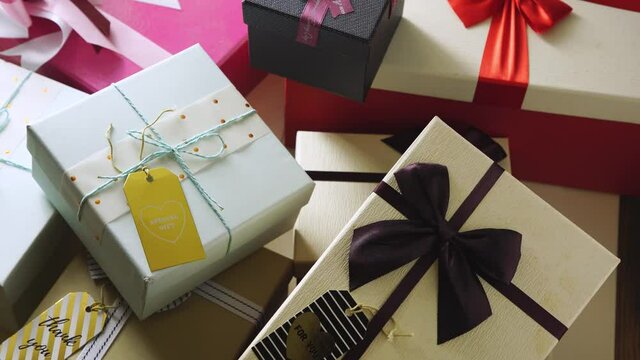 Gift box with ribbon and greeting tag . High angle view
