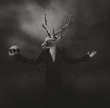 Animals in clothes.  human figure with deer head keeps a skull in his hand. horror and halloween concept