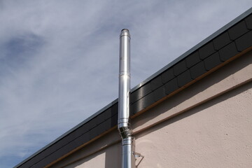new stainless steel chimney on a house
