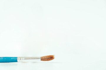 Round artistic brush for painting on a white background. Copy, empty space for text
