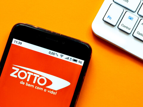 In this photo illustration  a Zotto logo is seen displayed on a smartphone