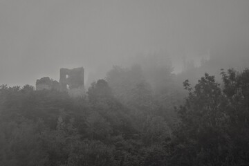 ruins of an old castle in the fog