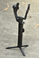 3-axis gimbal stabilizer with out DSLR camera stock image.