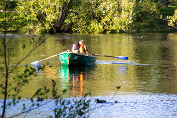 Russia, Pushkin-August 21, 2020: Photo of a boat with people swimming on the river