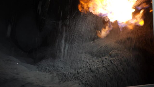 Mixing the charge for sinter production.Close-up.