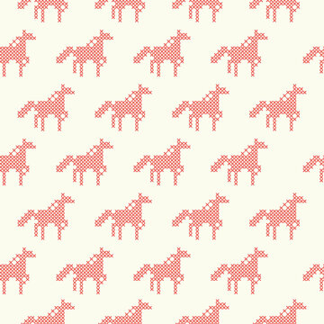 The seamless pattern with the cross-stitch red horses on the beige background.