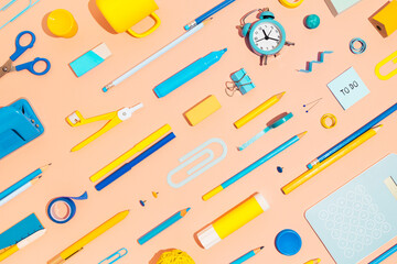 Creative flat lay with school stationery, on pink background. Banner.