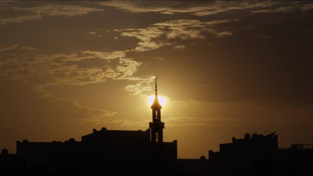 An amazing staic shot of the  silhouette of the islamic mosque in Dubia with the amazing color of the horizon