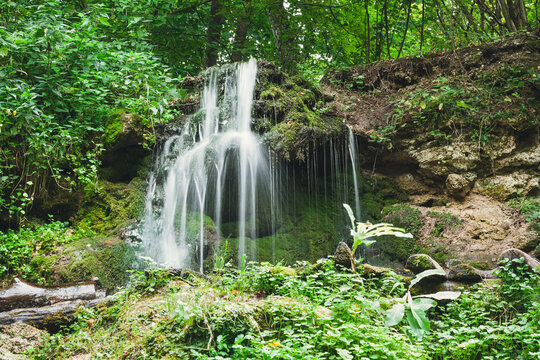 Waterfall in the summer forest. Eco trail in Pushchino on the Oka. Moscow region