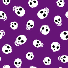 Seamless Halloween skull pattern on purple background