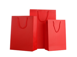 Red paper shopping bags isolated on white