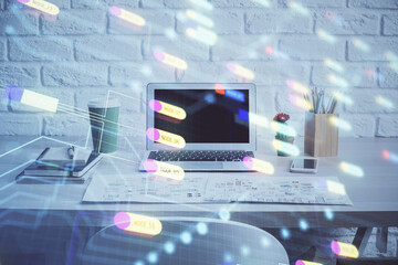Double exposure of desktop computer and technology theme hologram. Concept of software development.