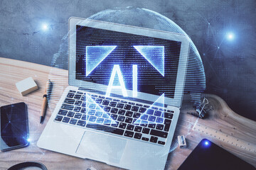 Double exposure of desktop computer and technology theme hologram. Concept of software development.