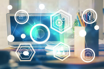 Computer on desktop with social network hologram. Multi exposure. Concept of international people connections.