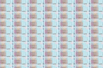 1000 Ukrainian hryvnias bills printed in money production conveyor. Collage of many bills. Concept...