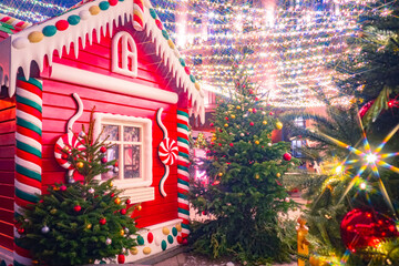 Christmas house on streets of Moscow. New year in Russia. Christmas trees next to Russian hut. New...